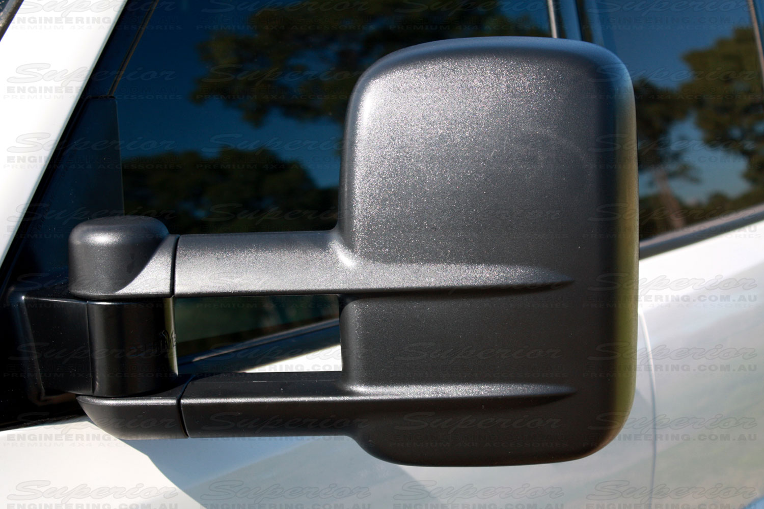 Closeup view of black Clearview Towing Mirror fitted to a late model Pajero