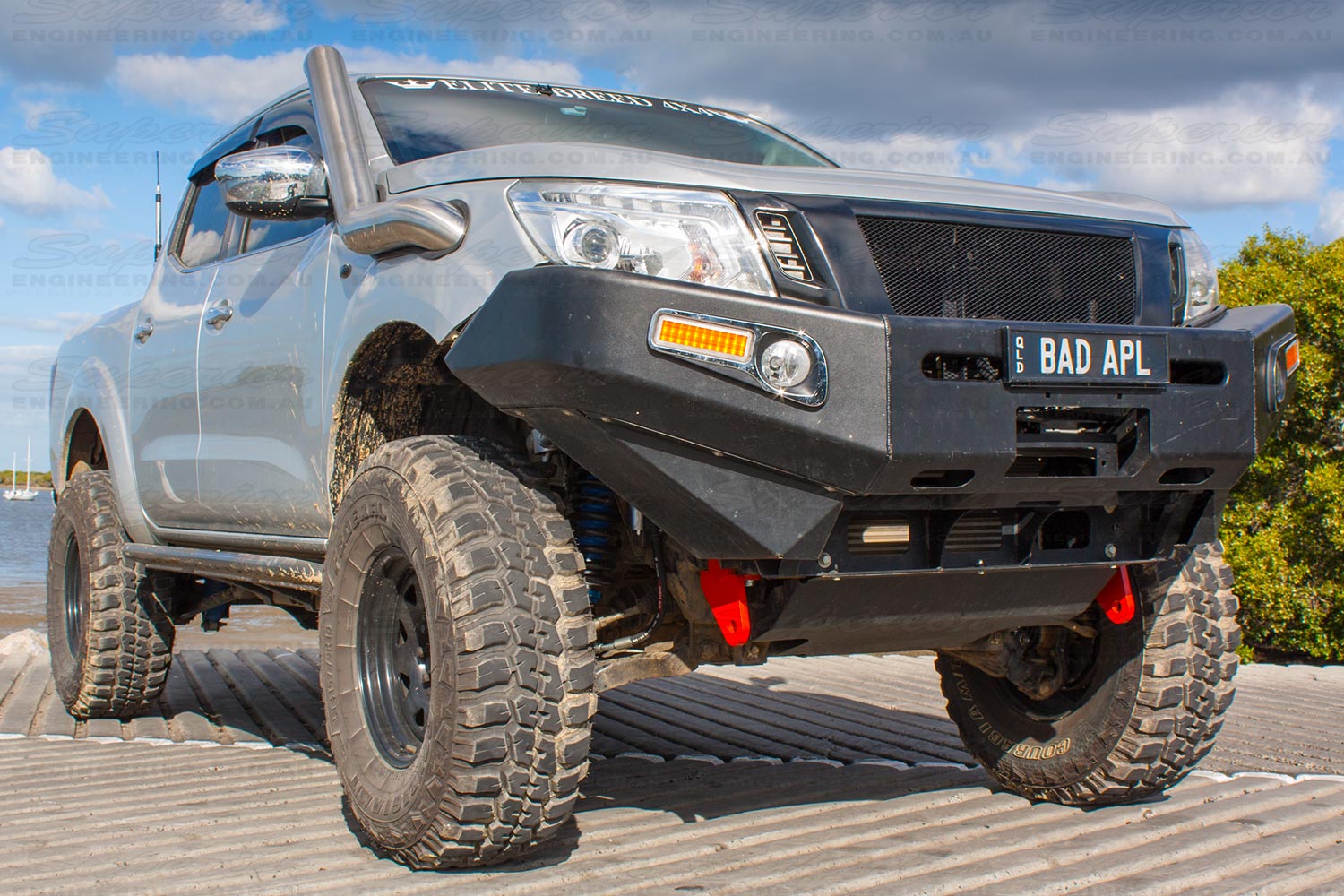 Front right view of the silver NP300 Nissan Navara dual cab at the Burpengary boat ramp after being fitted with a pair of heavy duty rated towing points